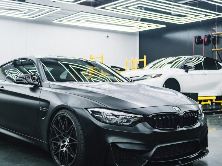 Contemporary black automobile standing in garage